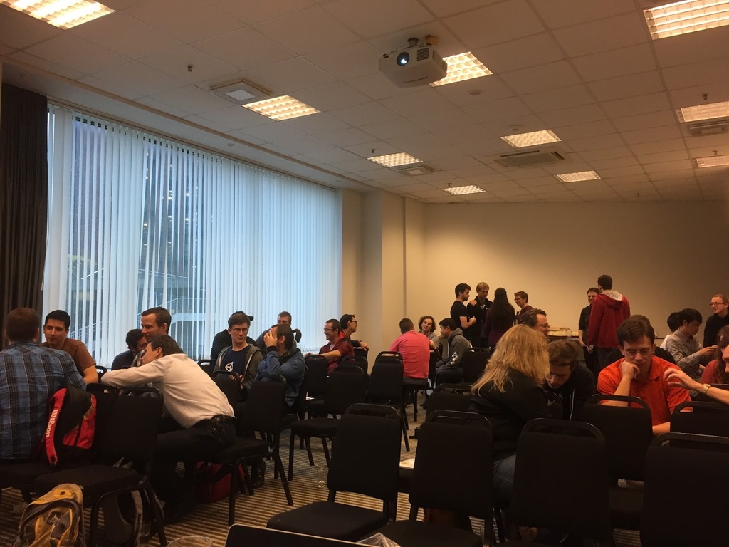Attendees having discussions in the workshop